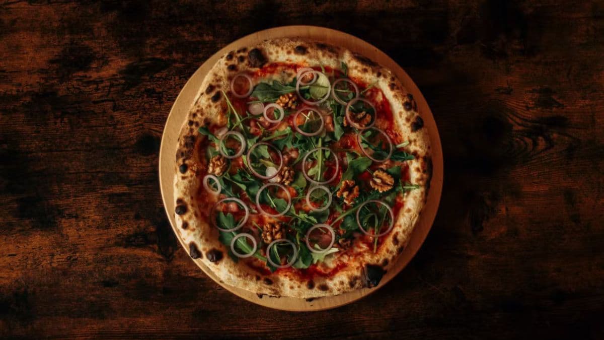 Pizza with leaves on top