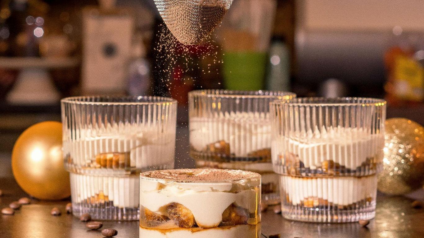 Layered dessert with cocoa dusting