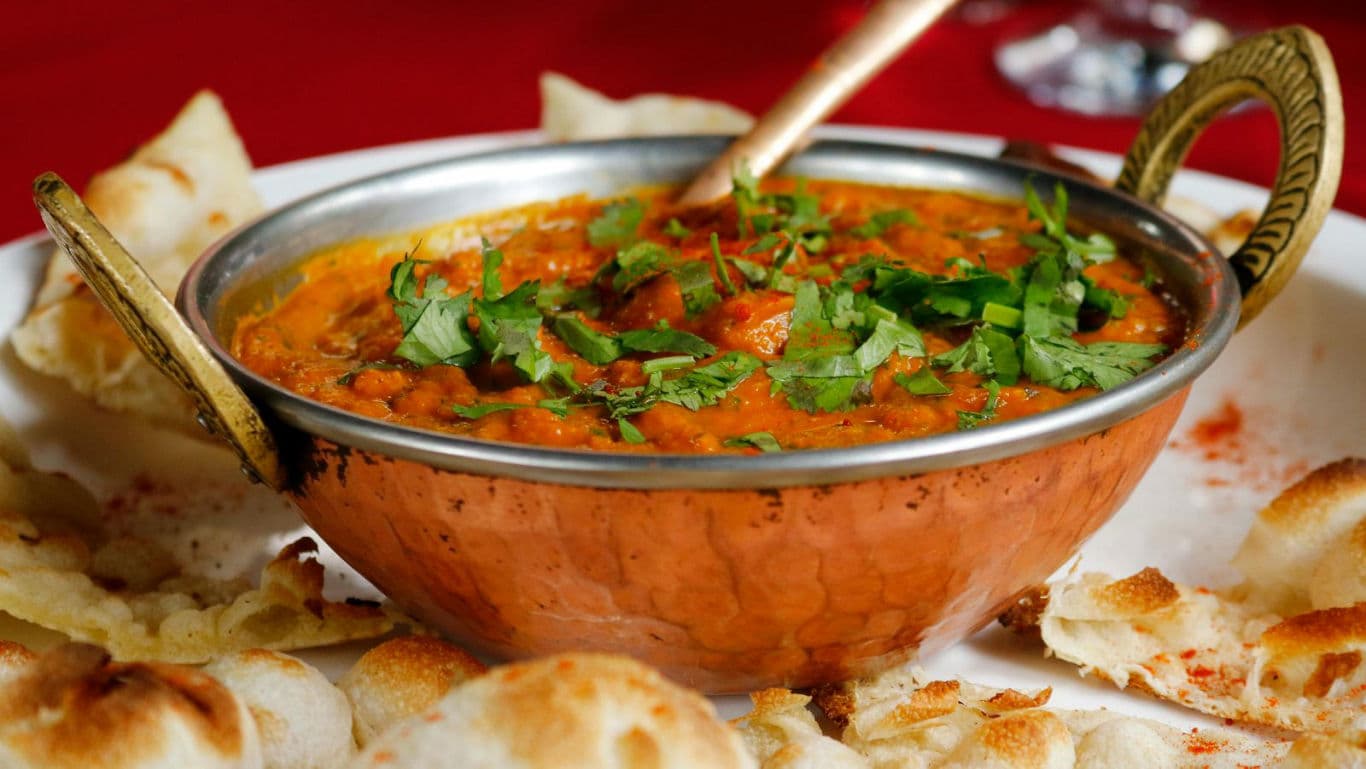 Traditional Indian Curry Served in Copper Bowl
