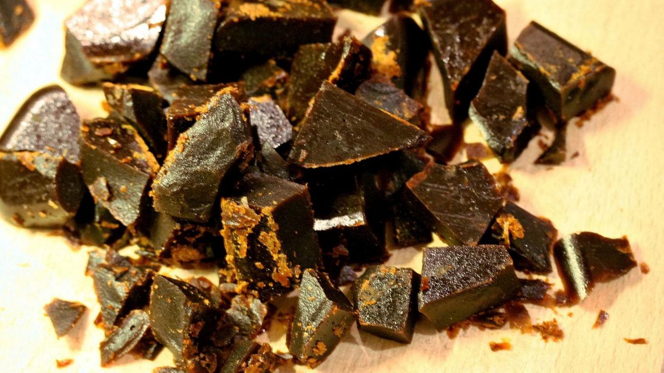 Close-up of dark chocolate chunks on wood