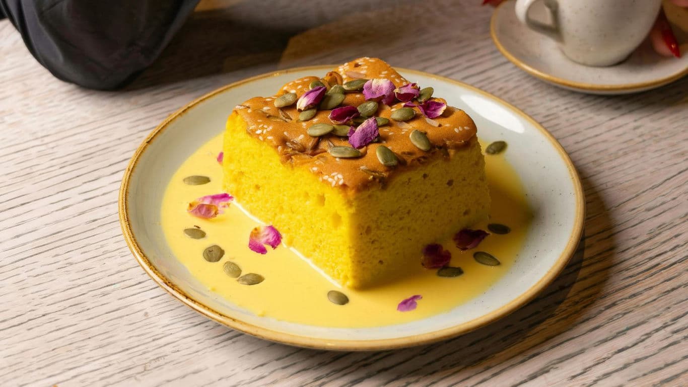 Yellow sponge cake with seeds and rose petals