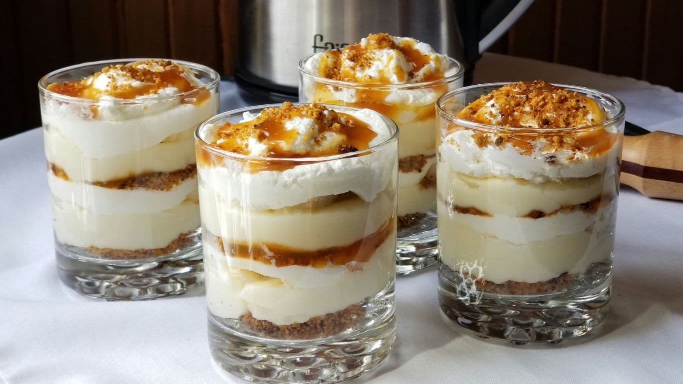 Layered dessert glasses with caramel topping