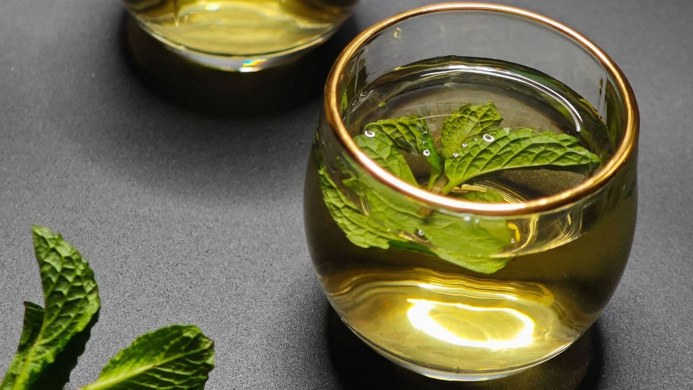 Glass cups of herbal mint tea
