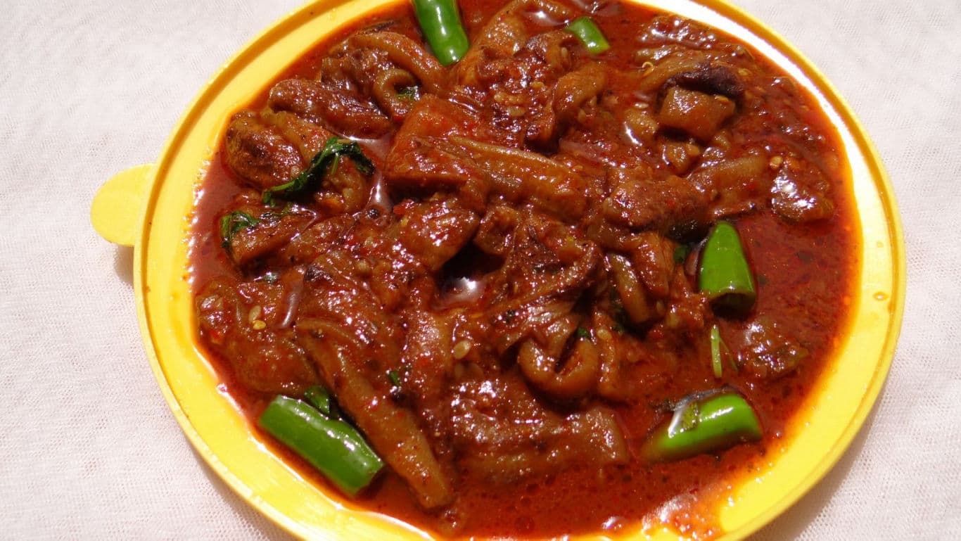 Spicy Indian Pickle with Green Chilies in Yellow Bowl