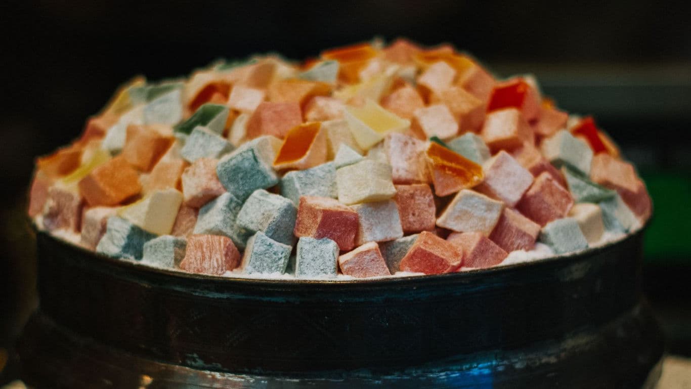 Colorful powdered sugar-coated candy cubes