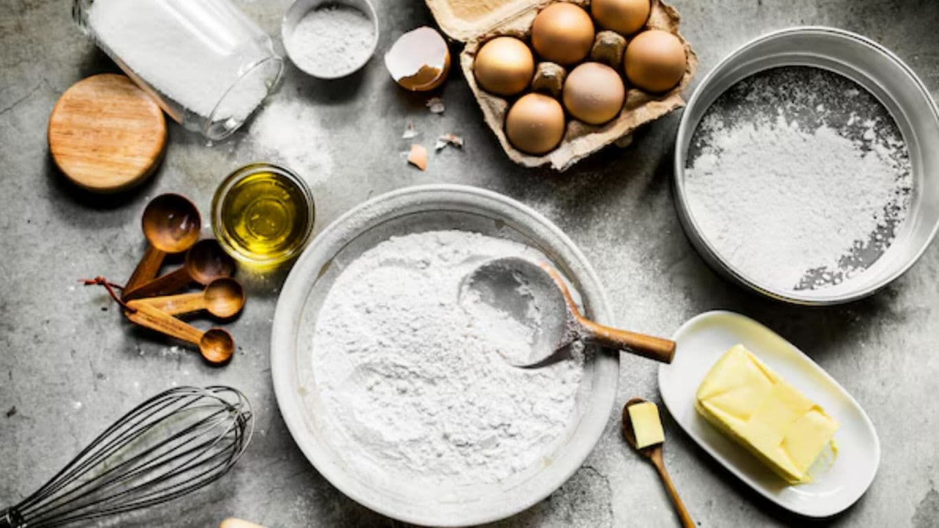 Baking ingredients and utensils on kitchen countertop