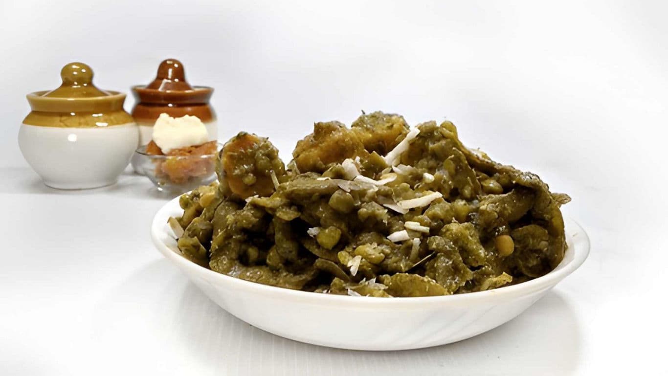 Traditional green curry with coconut garnish