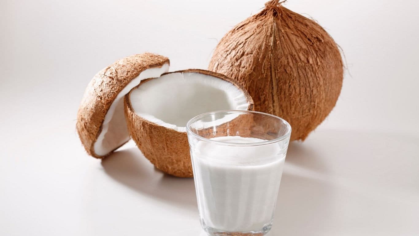 Fresh coconut milk in clear glass