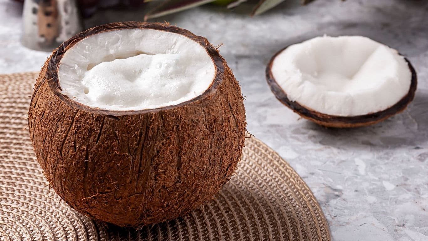 Fresh coconut halves filled with creamy foam