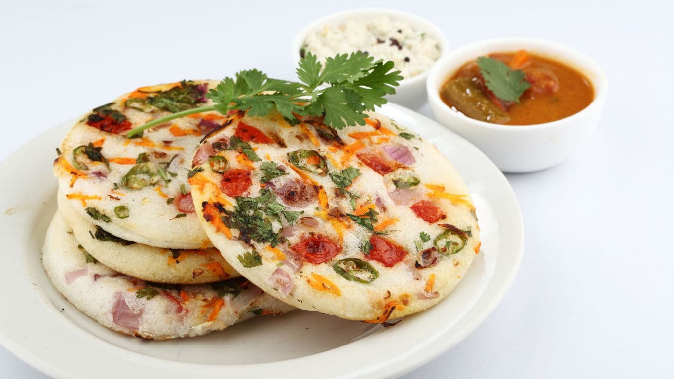 South Indian vegetable uttapam with chutney and sambar
