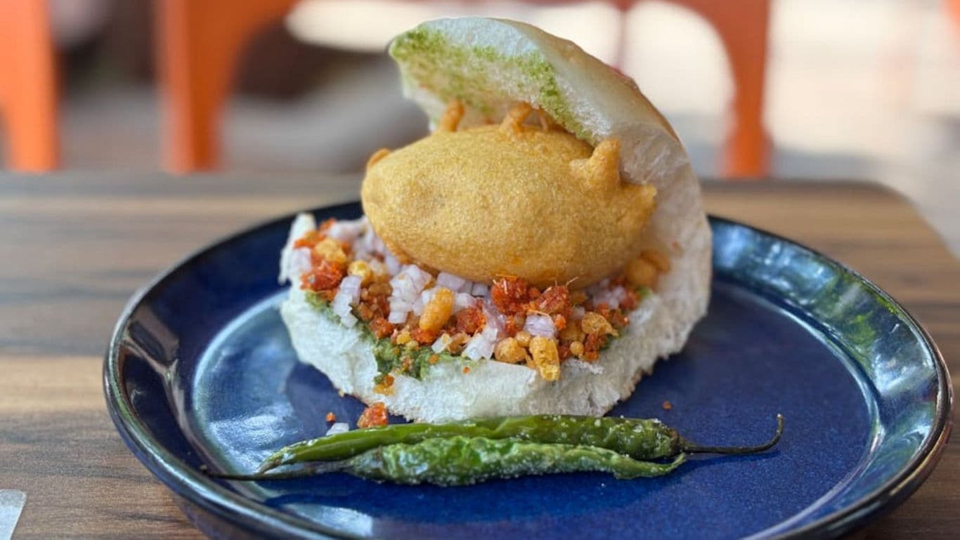 Indian street food dish with chili garnish