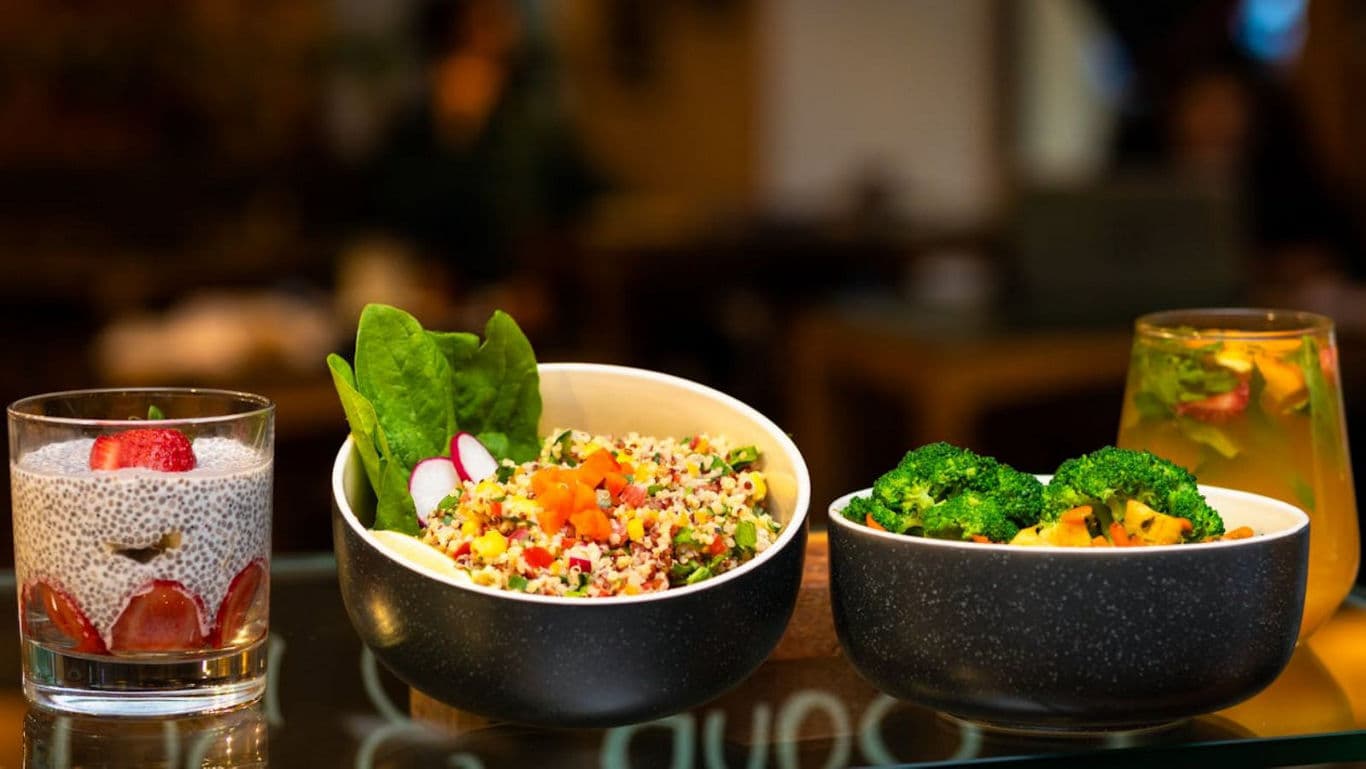 Healthy quinoa salad, chia pudding, and broccoli meal