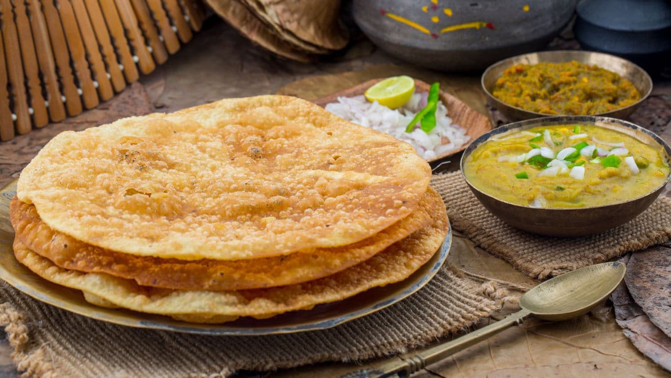 Crispy Indian Poori with Lentil Curry and Sides