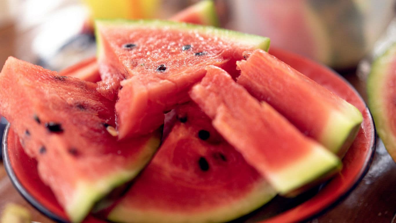 Freshly Sliced Watermelon on Red Plate