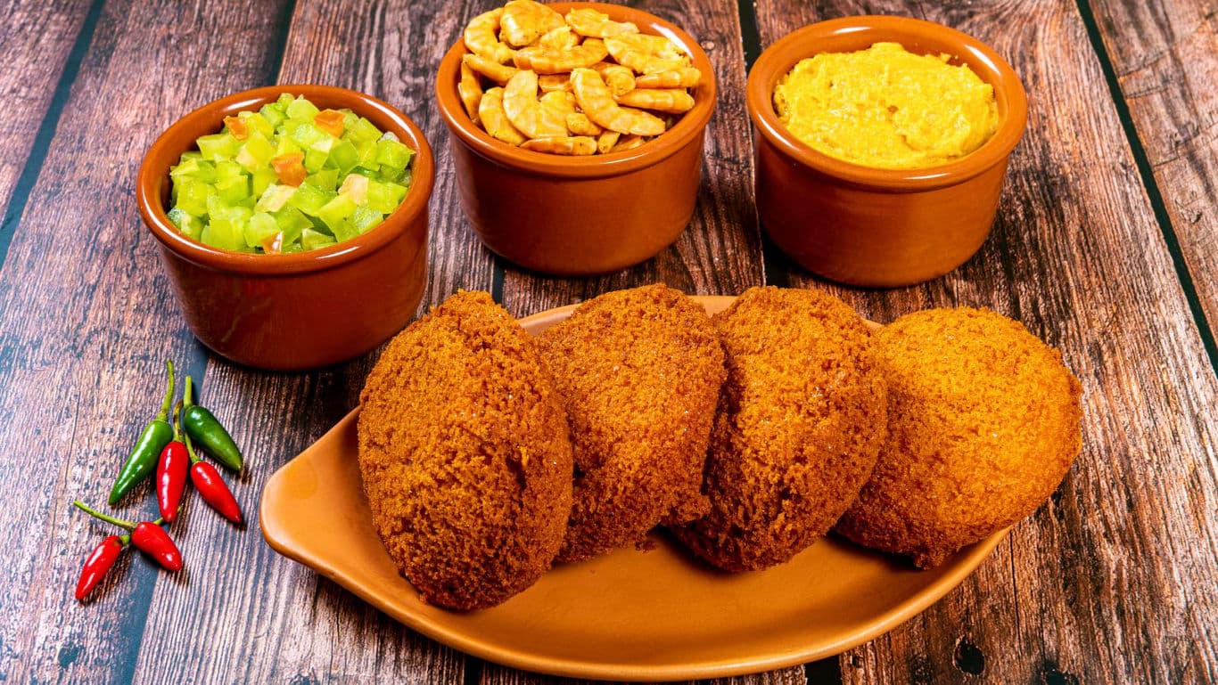 Fried snacks with dips on rustic table
