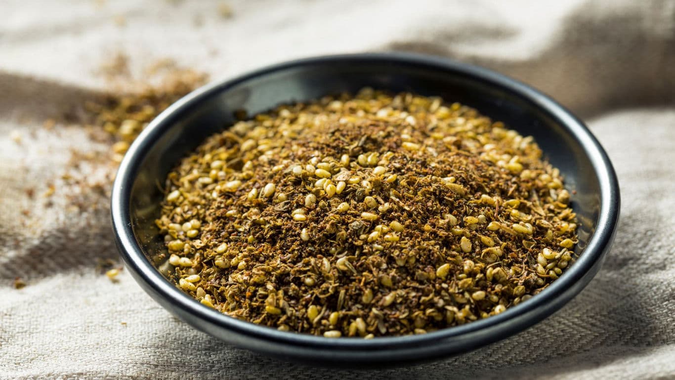 Bowl of mixed ground spices on cloth