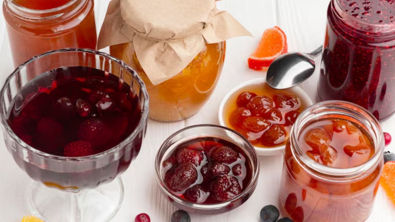 Assorted fruit preserves and jams in glass jars
