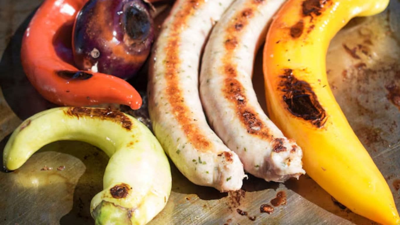 Grilled Sausages and Colorful Vegetables on Metal Tray