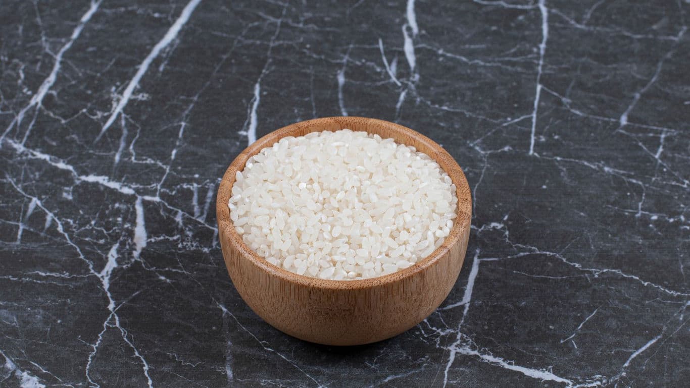 Wooden bowl filled with white rice