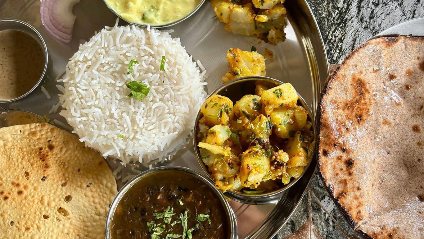 Traditional Indian thali with assorted dishes