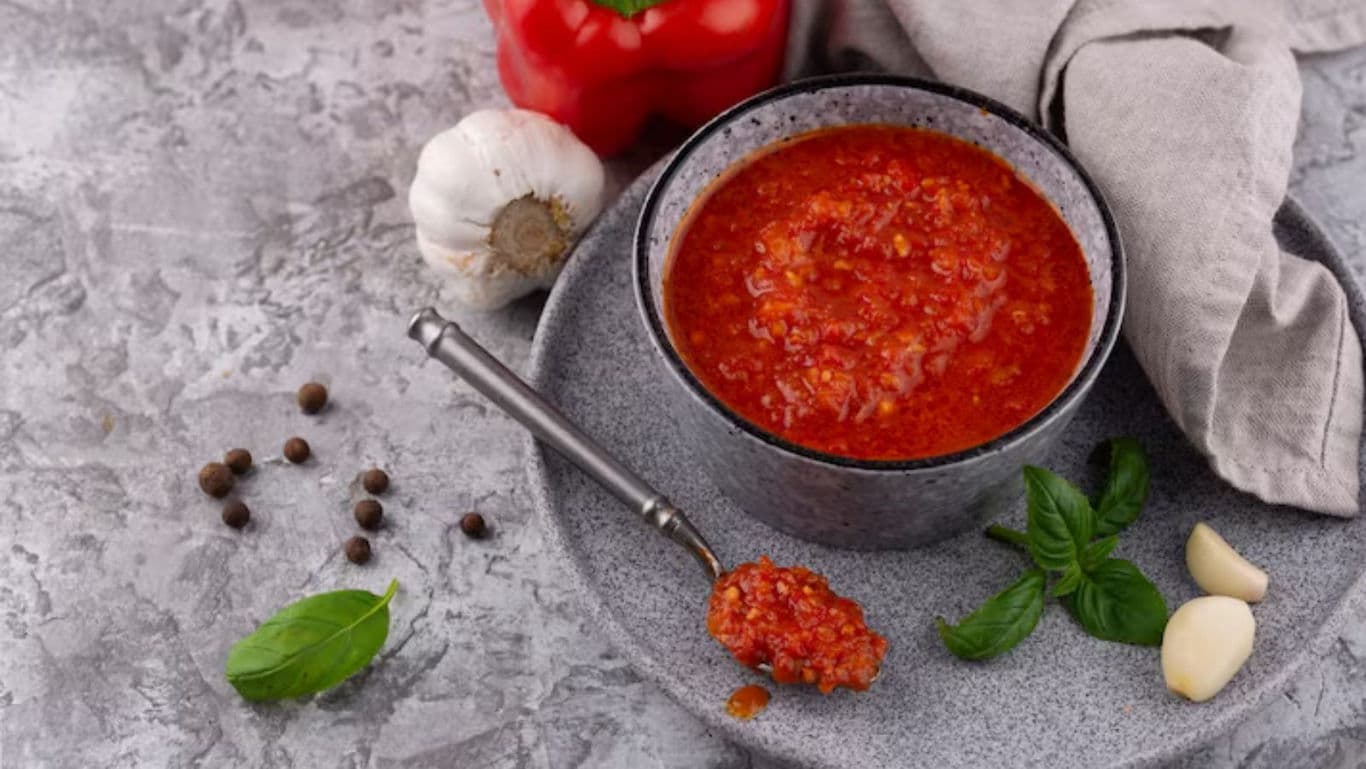 Bowl of Red Pepper Sauce with Fresh Ingredients