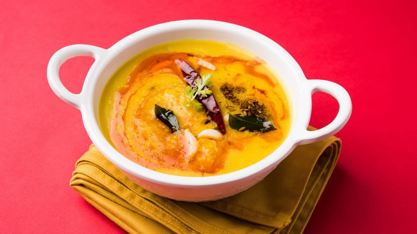 Traditional Indian dal tadka in white ceramic bowl
