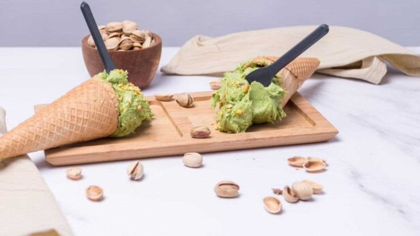 Pistachio Ice Cream Cones with Scattered Nuts