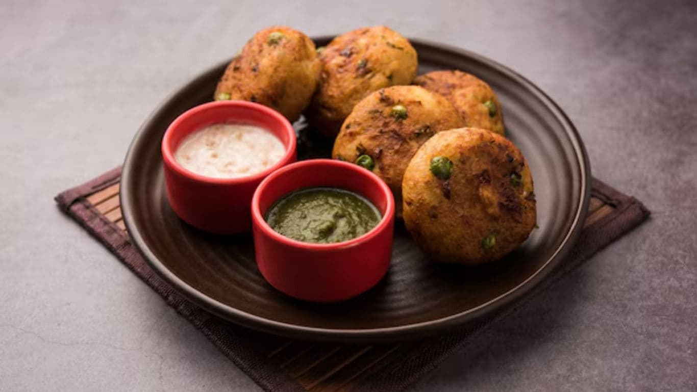 Indian potato patties with green and white chutney