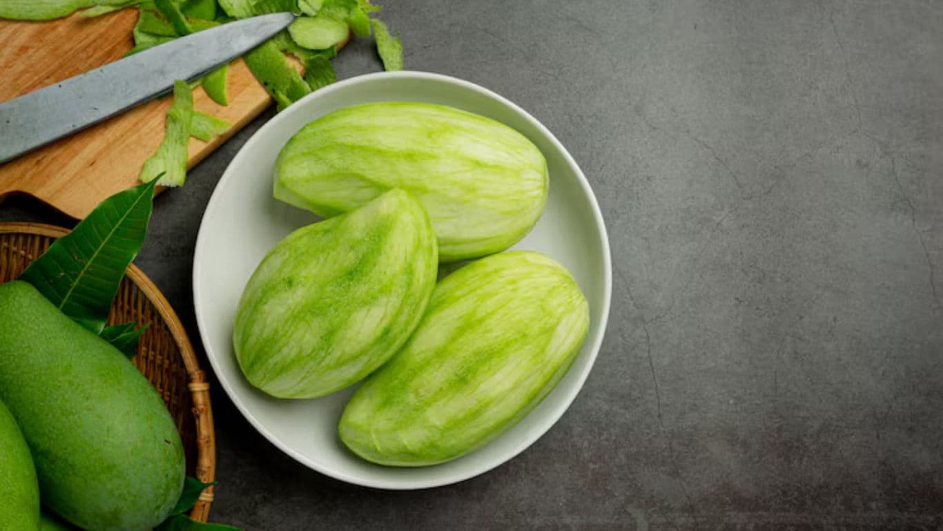 Peeled Green Mangoes in White Bowl on Table