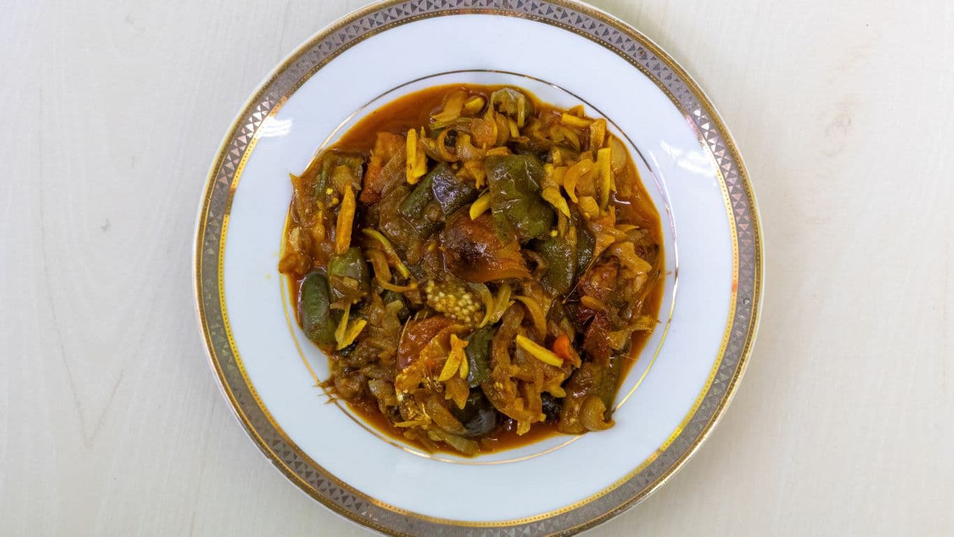 Spicy vegetable curry served in ornate plate