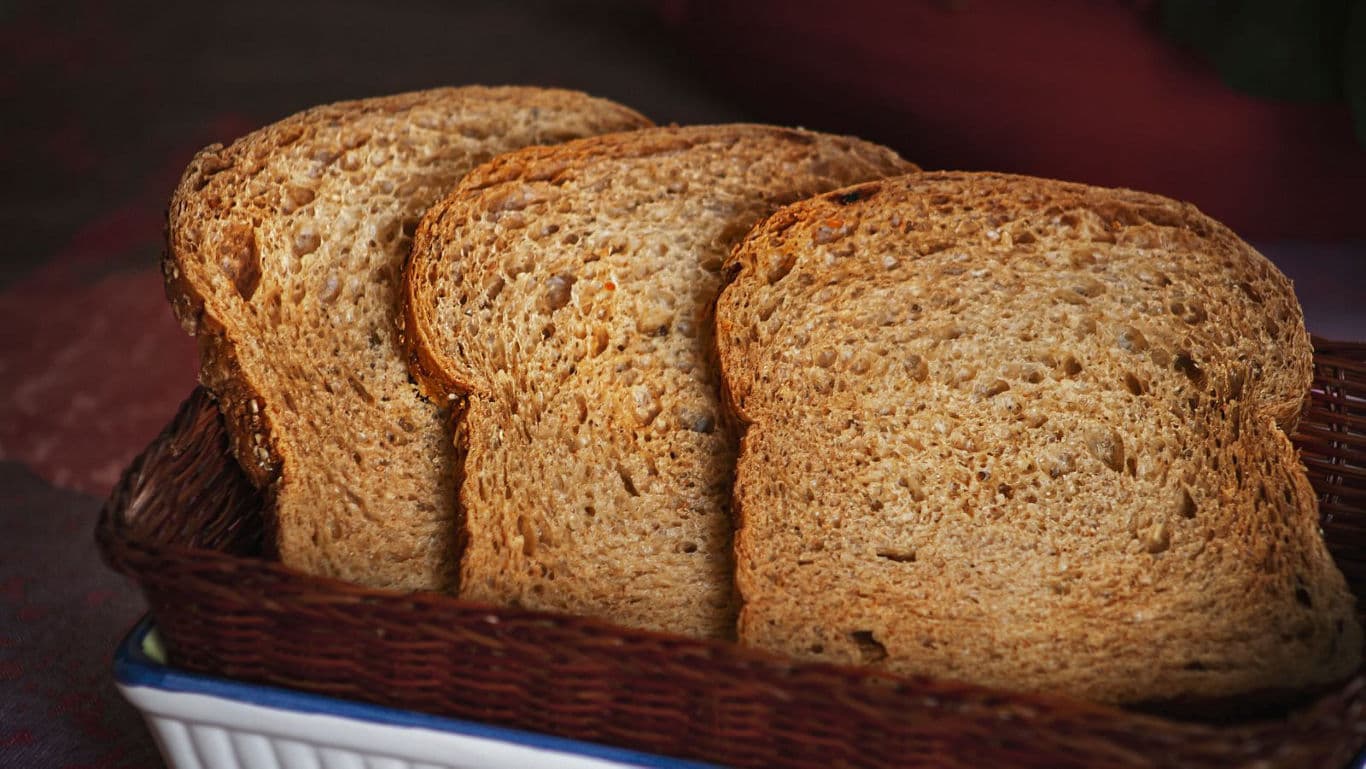 Slices of toasted brown bread in basket