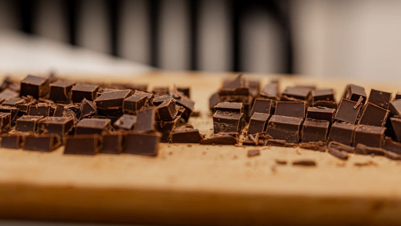Close-up of chopped chocolate pieces on board