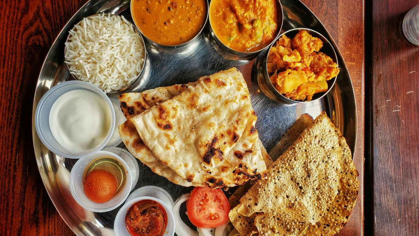 Traditional Indian thali with assorted dishes