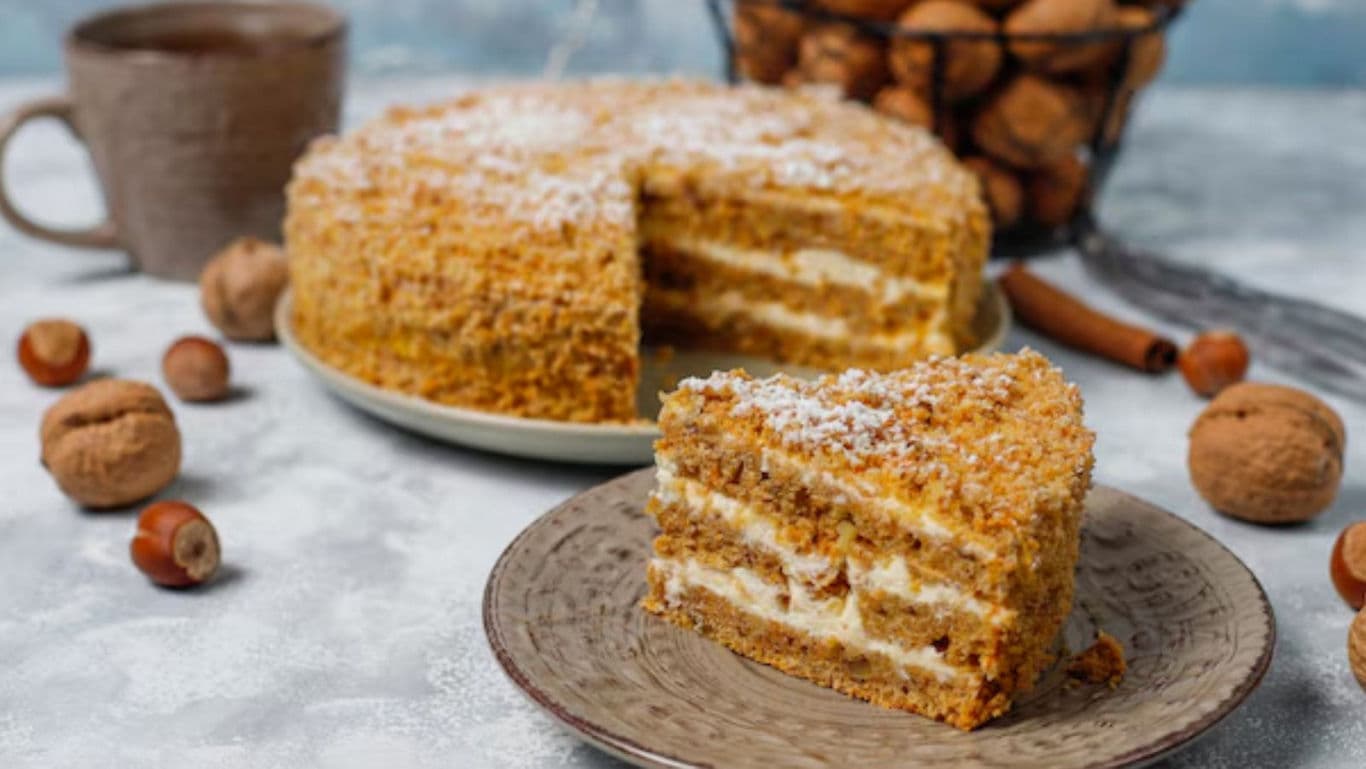Layered nut cake slice on rustic plate