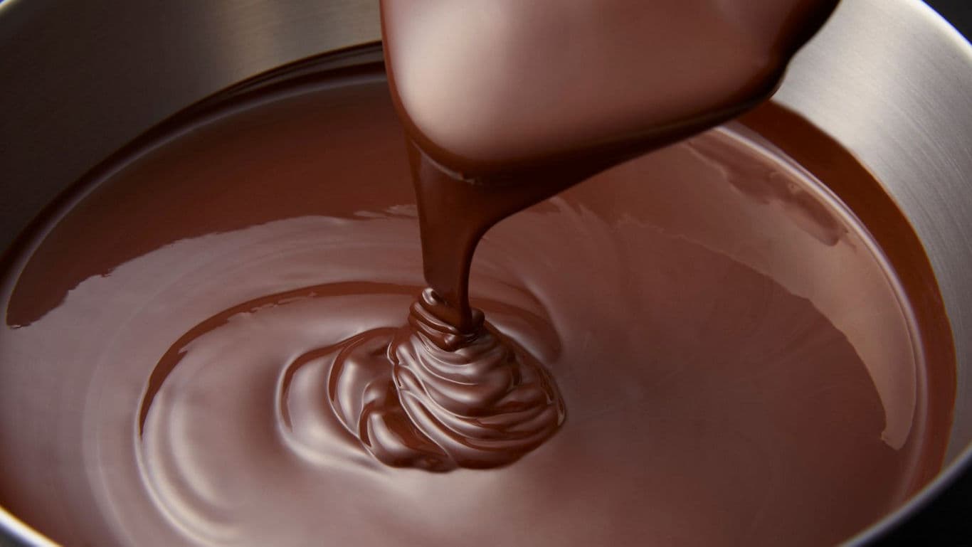 Melted chocolate being poured into bowl