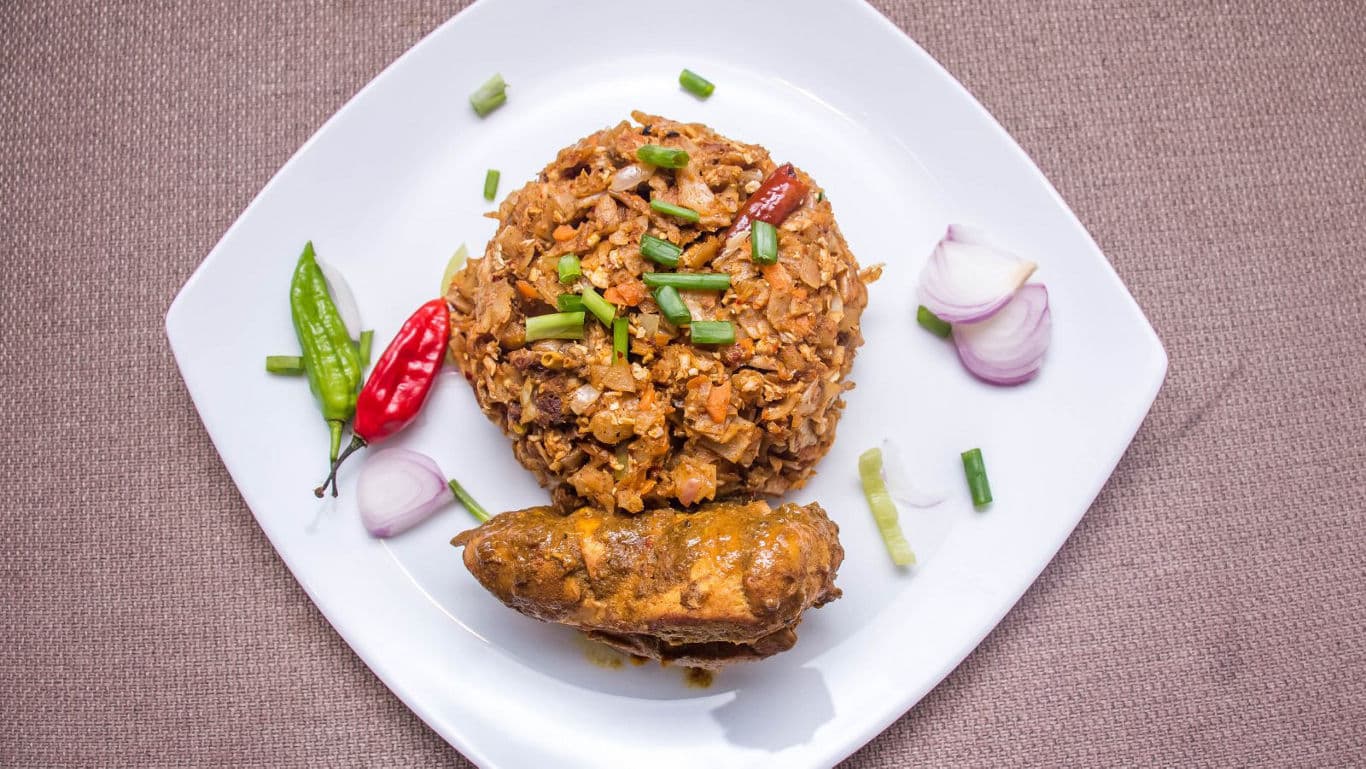 Spicy rice and chicken curry on plate