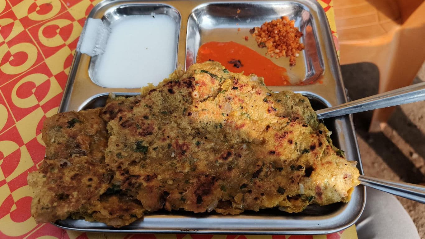 Traditional Indian savory pancake with chutneys served