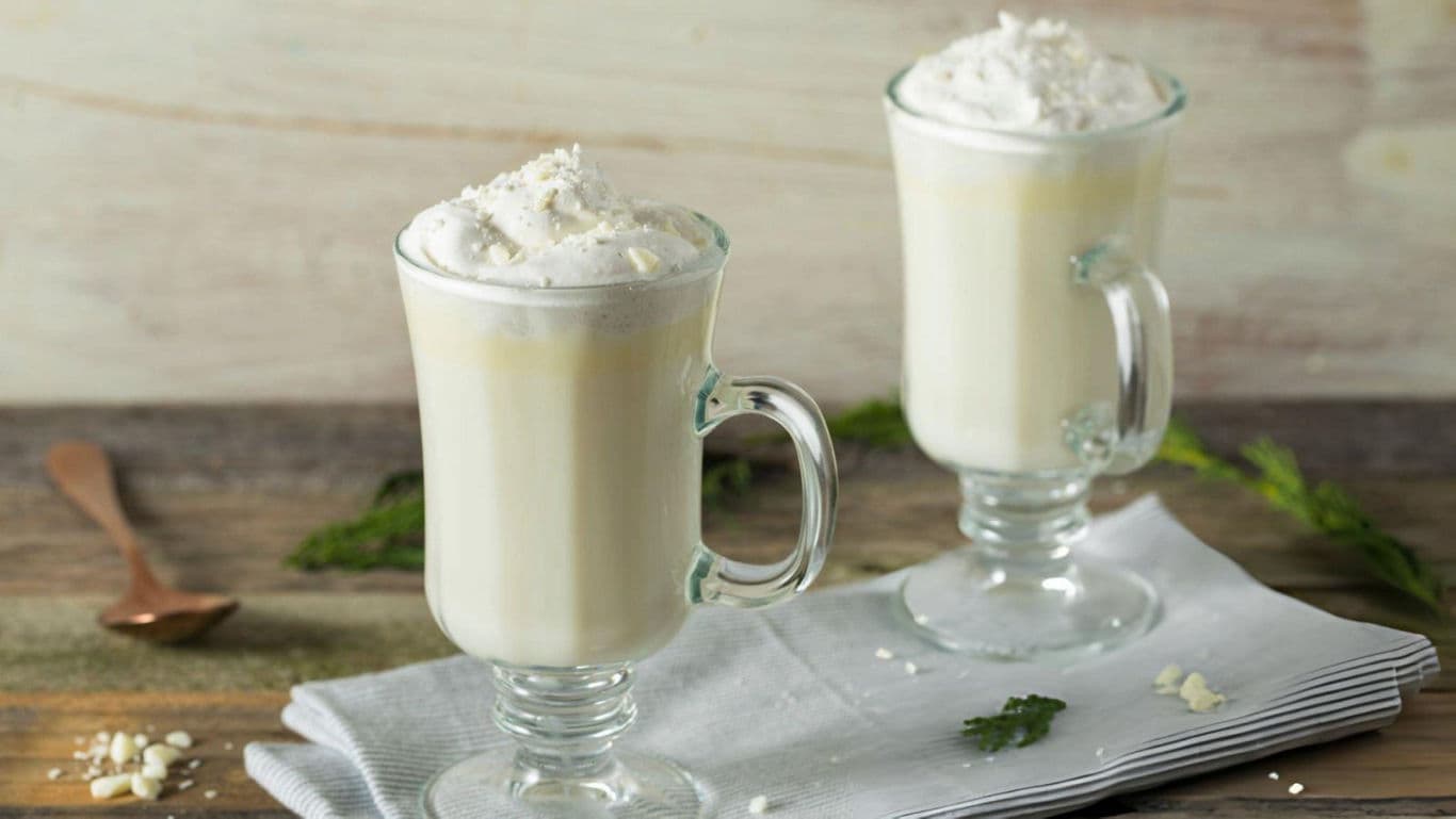 Two Creamy Milkshakes in Glass Mugs