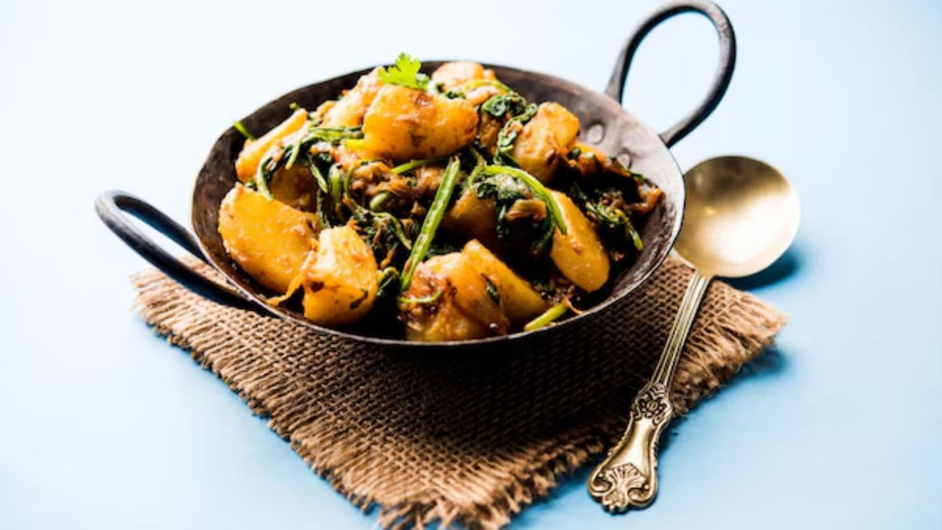 Spiced potato and spinach curry dish