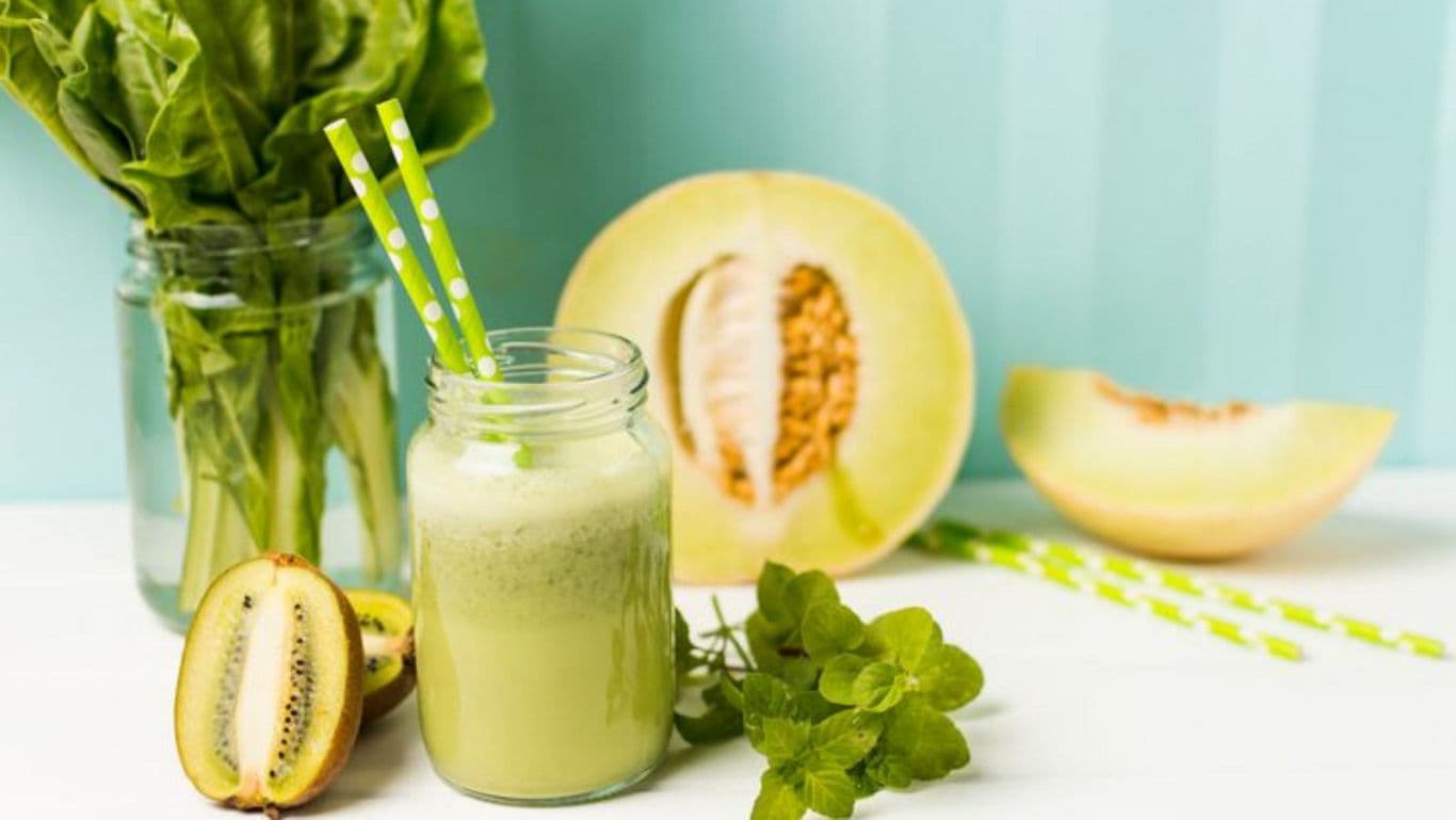 Green melon smoothie with fresh fruit ingredients
