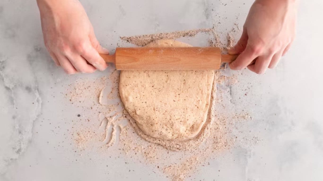 Rolling dough on a floured surface
