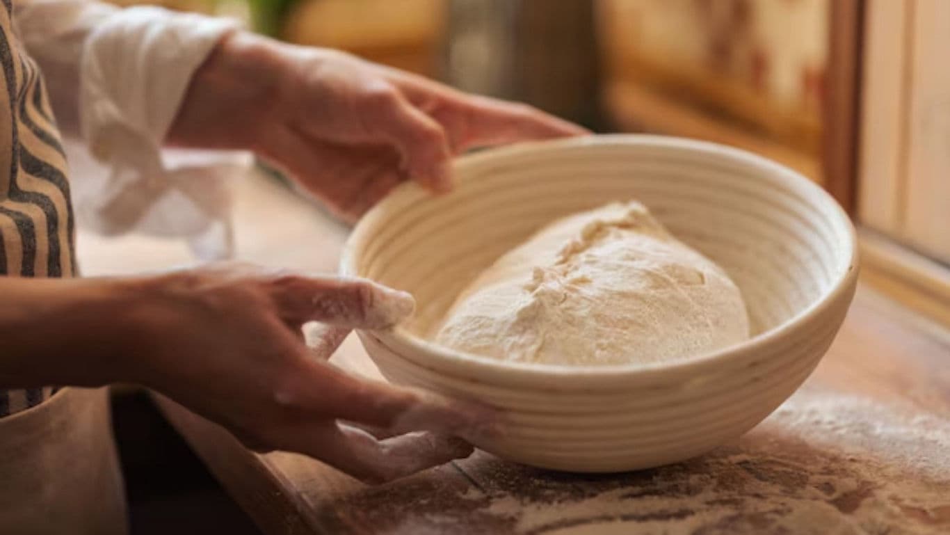 Hands Preparing Dough in Rustic Kitchen