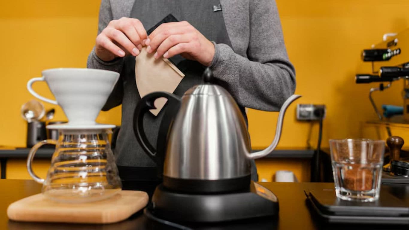 Barista Prepares Pour Over Coffee with Kettle