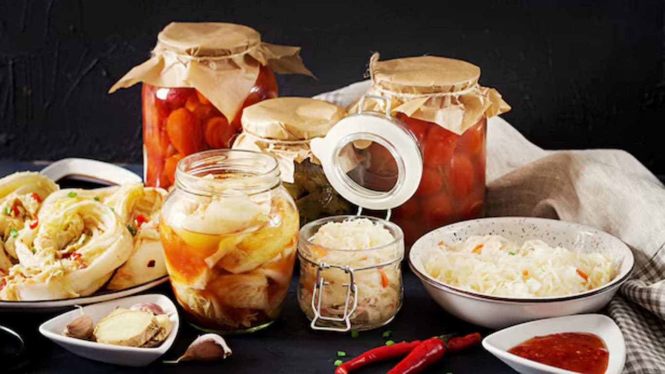 Assorted Homemade Pickled Vegetables in Jars and Bowls