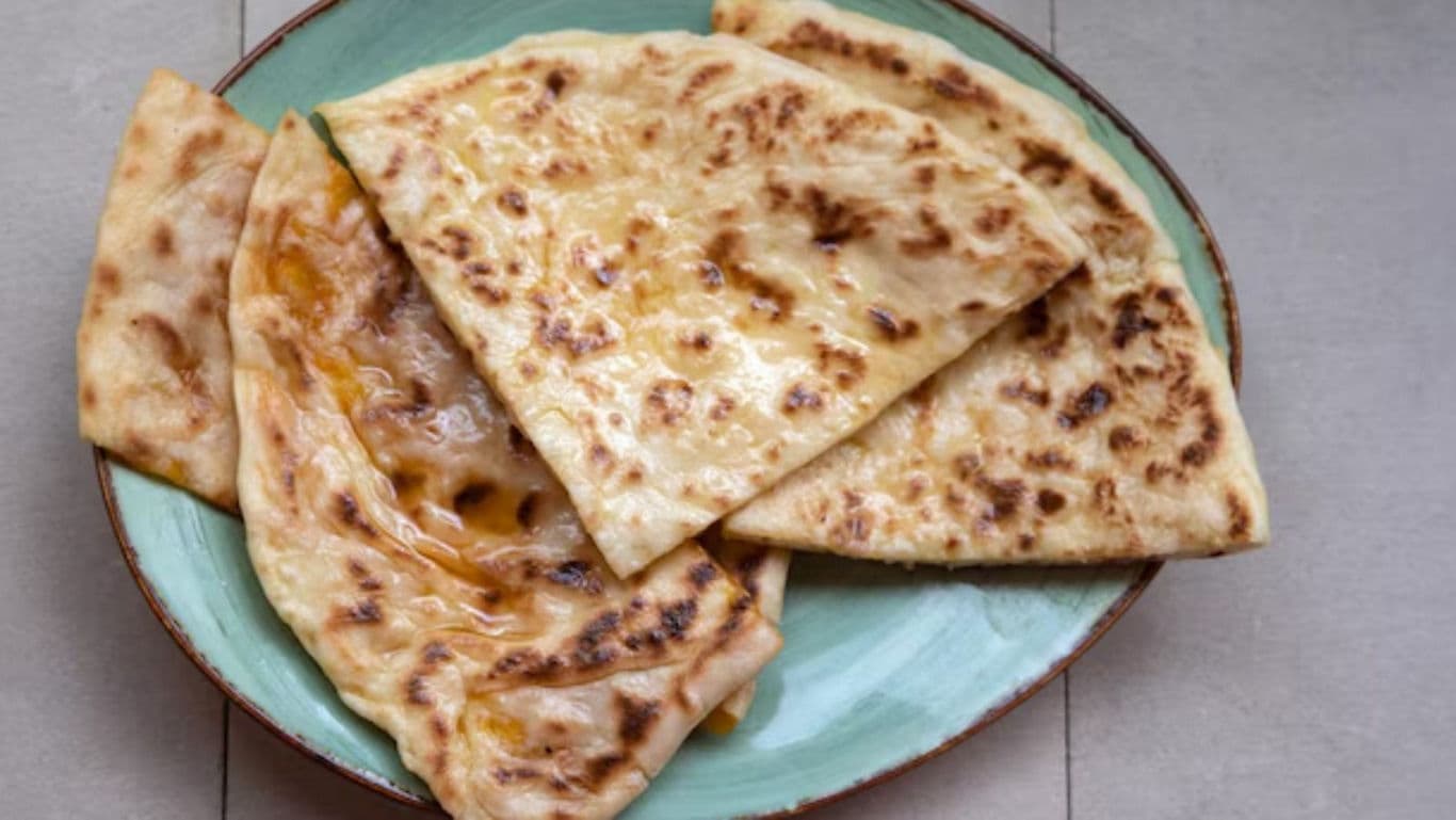 Freshly Cooked Flatbread on Green Ceramic Plate