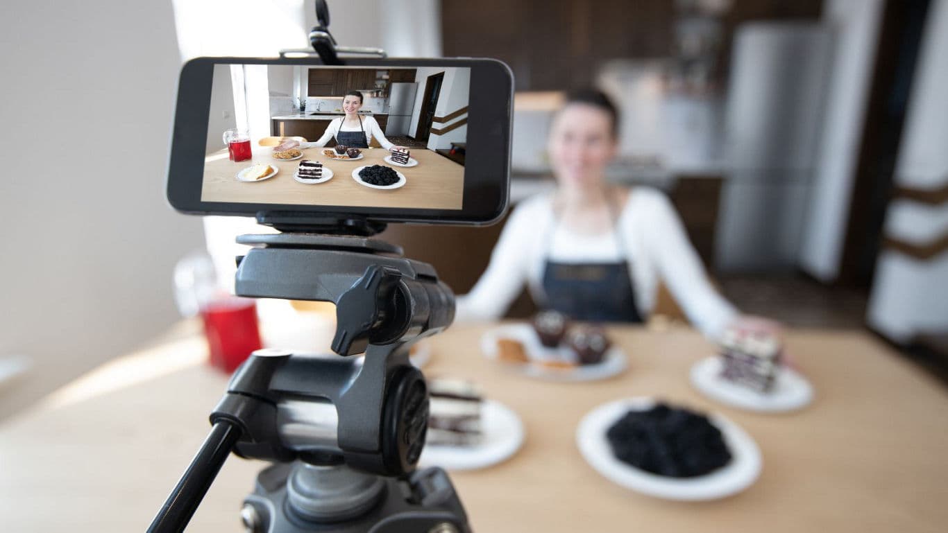 Food Blogger Filming Content With Visible Confidence