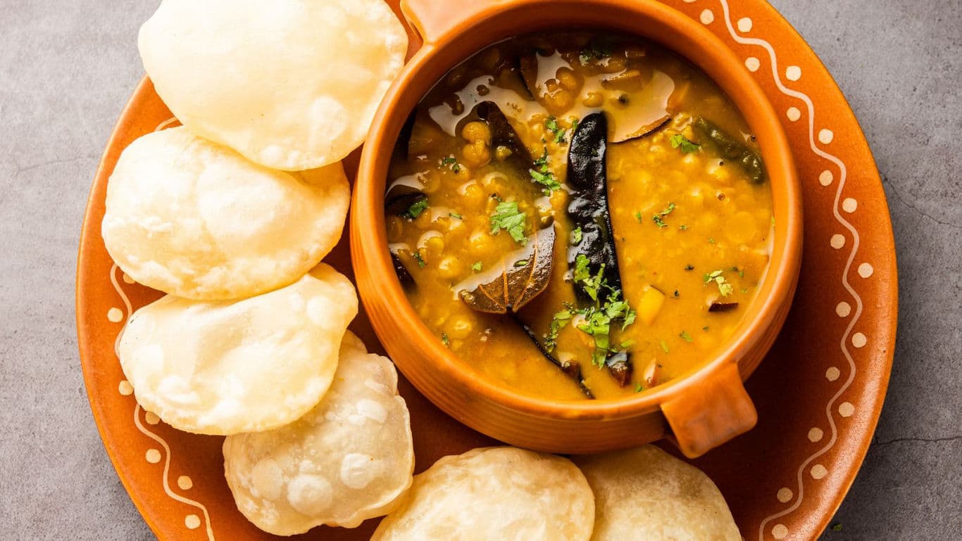 Indian lentil curry with puffed bread