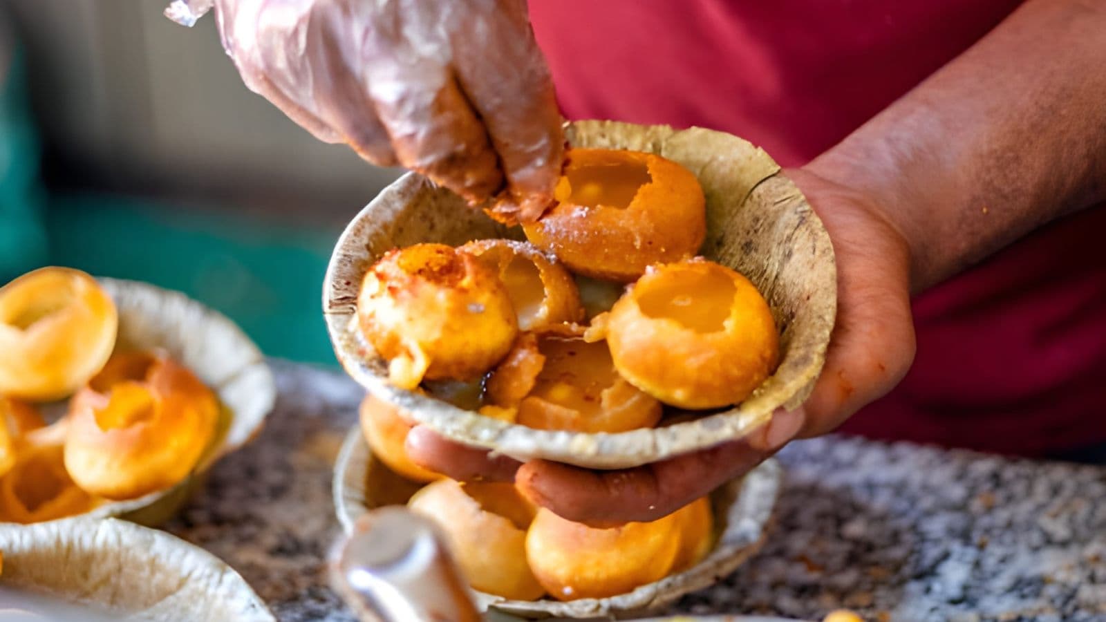 Street vendor serving Indian pani puri